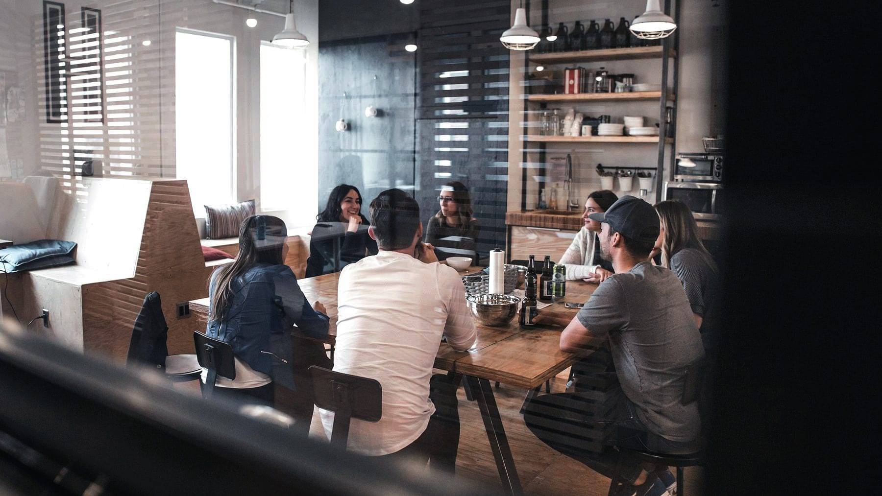A working meeting seen through the glass of a café