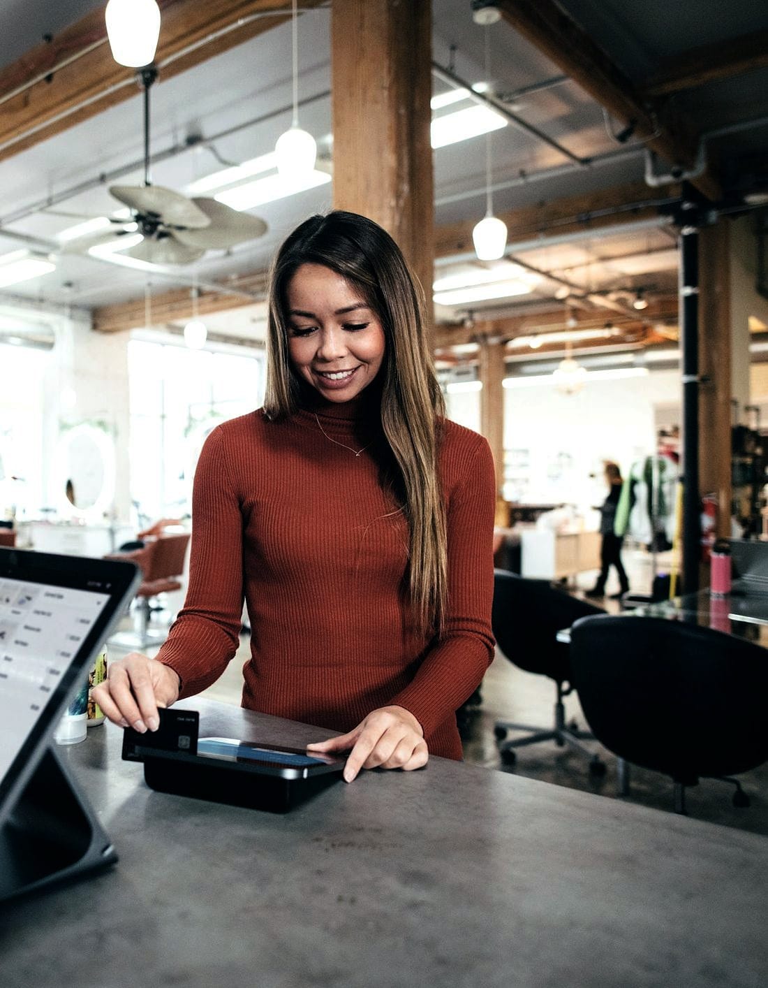 A card payment being taken at a shop counter terminal