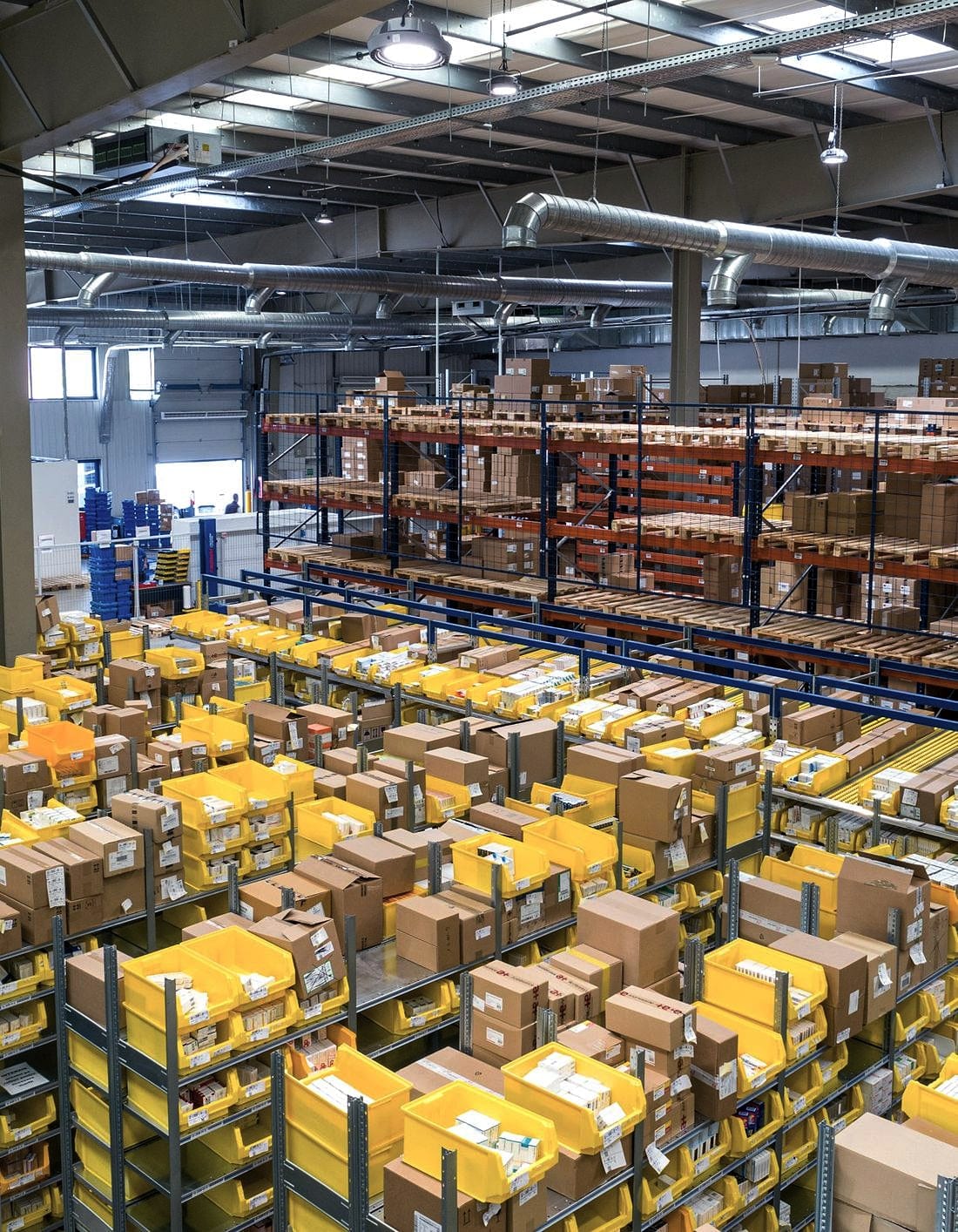Boxes stacked across the pick face of a distribution warehouse