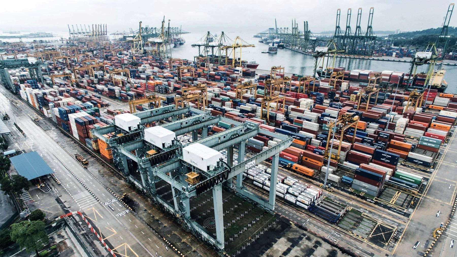 A container port from the air, stacks laid out along the quay