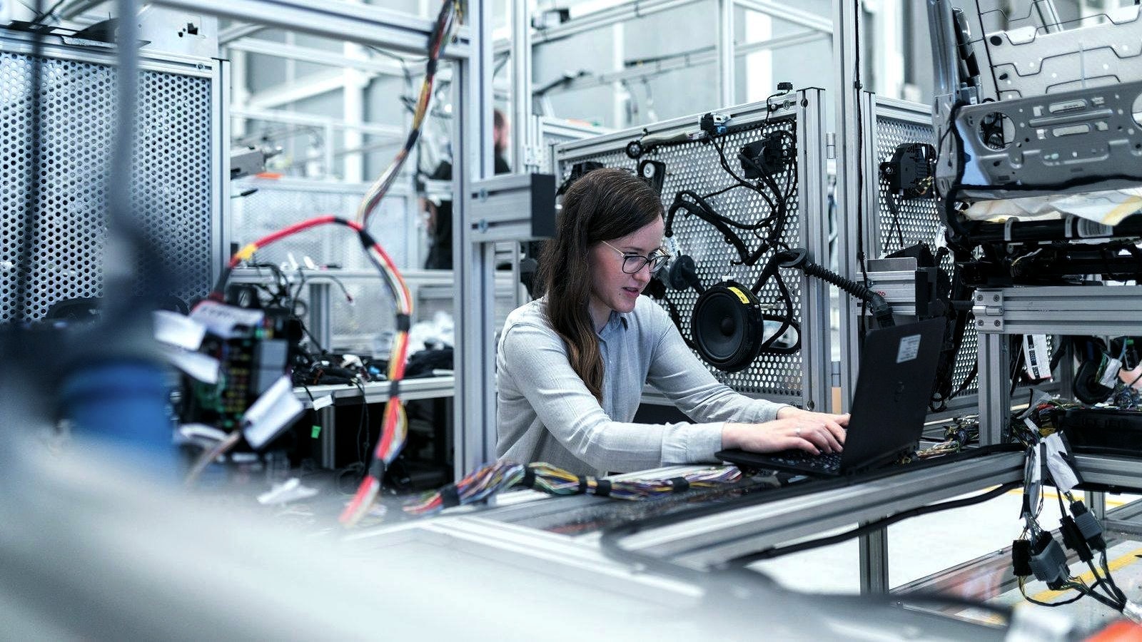 An engineer working at an automated test rig