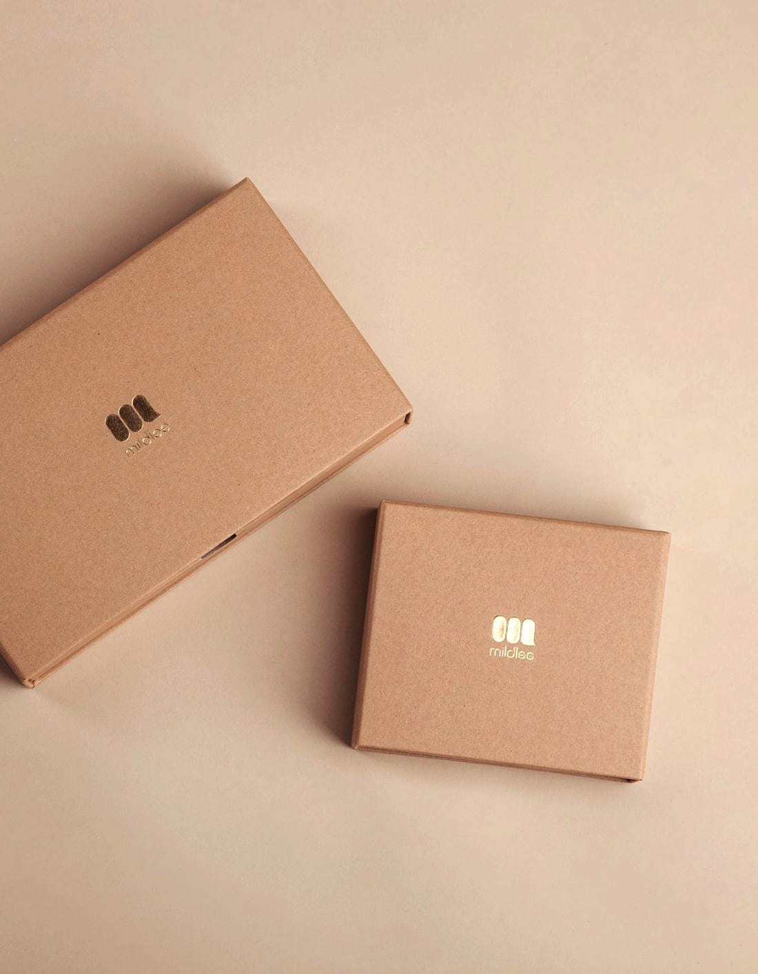 Two plain cardboard boxes packed and squared up