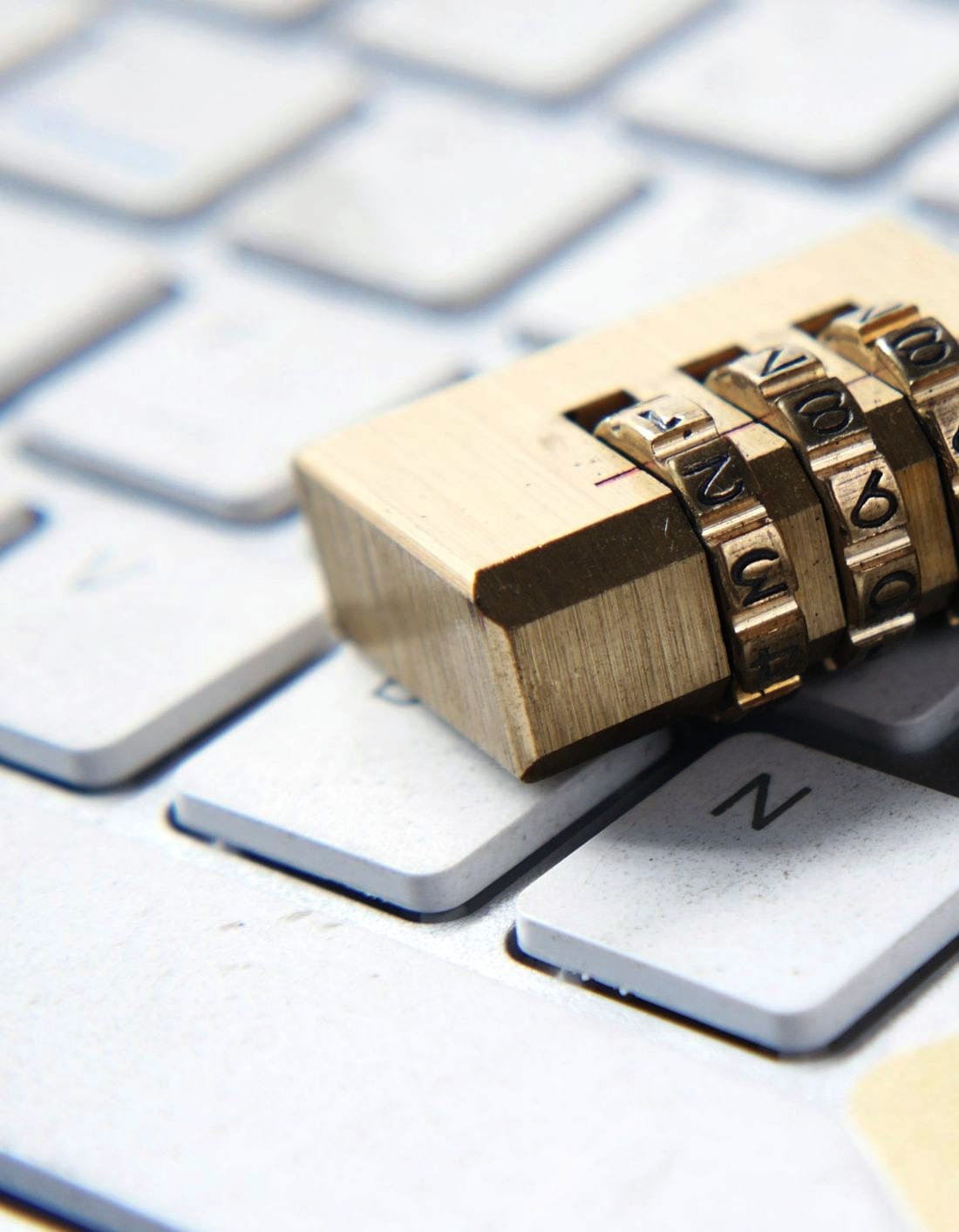 A combination padlock closed over a keyboard