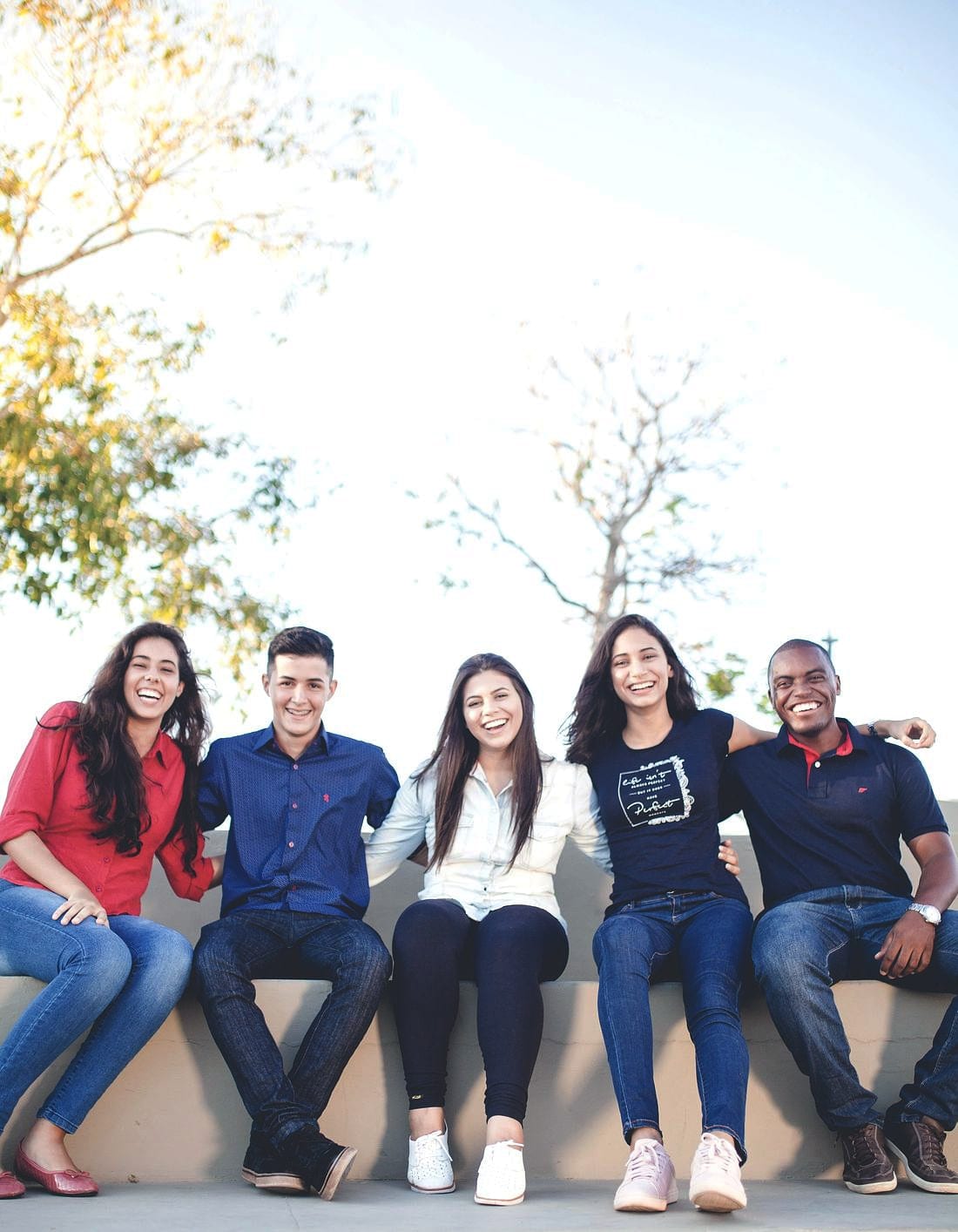 A group of people standing together outdoors after a session