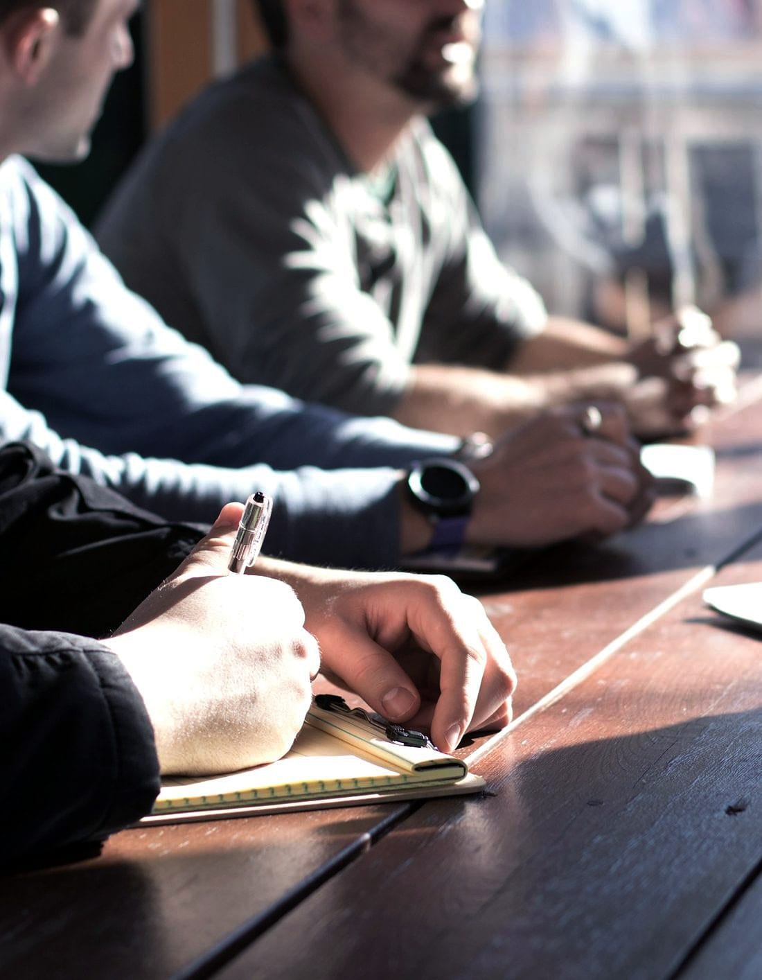 People around a table working through a document together