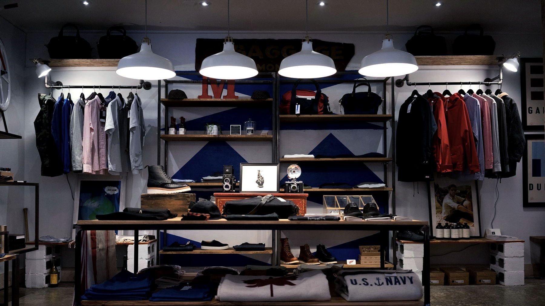 Clothing racked along the wall of a small shop